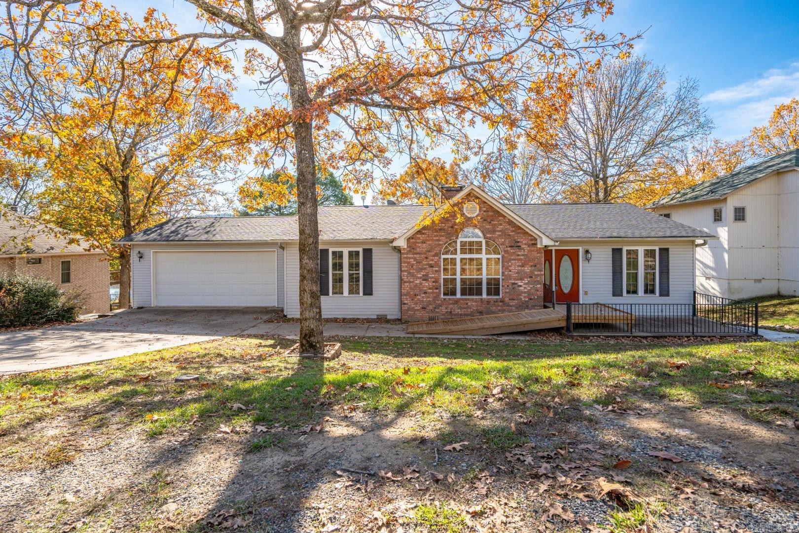 Comfortable handicap accessible home with large deck overlooking a serene setting of Diamondhead Golf Course. Ramp to front entrance and kitchen entrance through garage. Widened doorways, new paint and flooring upstairs. Master bath remodeled. New range, dishwasher, HVAC, barn doors, fence and so much more.