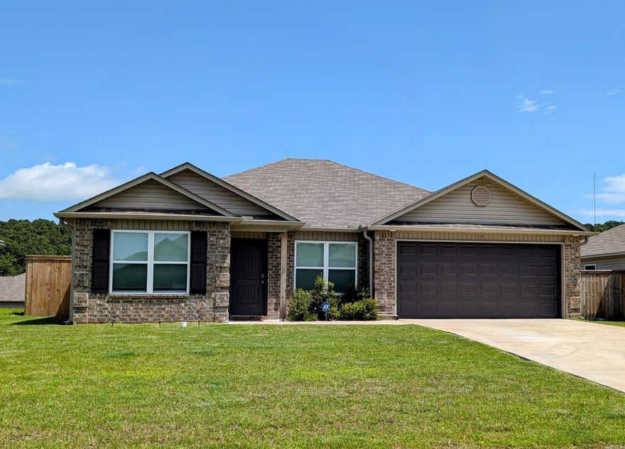 This 2023-built home is priced affordably and ready for you to move right in. Located just minutes from town, you’ll love the easy access to shopping, schools, and dining. Step inside to find stylish luxury vinyl flooring throughout the main living areas, with plush carpet in the bedrooms for that extra cozy feel. The open layout is practical and inviting, making everyday living a breeze. This home is move-in ready everything feels fresh and well-kept. Plus, it includes gutters! Outside, you'll appreciate the fully fenced backyard, offering privacy, safety for pets, and a great spot for outdoor fun or gardening. Whether you're grilling out, hosting a get-together, or just sipping your coffee in peace, you’ll love having this space to make your own. Call for your showing today,