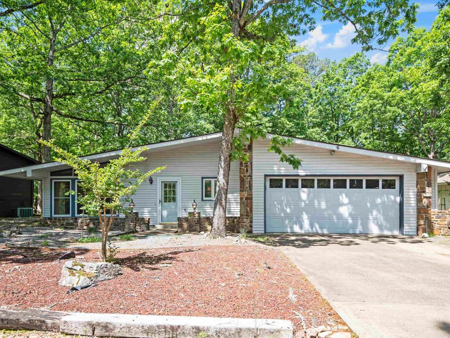 Discover the perfect blend of comfort and leisure in this inviting 3 bed, 3 bath, 2,300 sq ft home nestled in the peaceful, gated Hot Springs Village—just across the street from scenic DeSoto Lake! Step into a sun-filled living room with a wall of windows and a cozy fireplace, ideal for morning coffee or quiet evenings. Unwind in your private sauna, then soak in the hot tub on the back deck while enjoying peekaboo lake views. The level lot makes daily living easy, and a spacious bonus/hobby room with private entrance adds endless flexibility. Enjoy access to miles of hiking trails, pickleball, golf, beaches, and restaurants just minutes away. Welcome home to relaxation, recreation, and a community you’ll love!***** (See attached Video)*****Agents See Remarks* First time buyers are subject to a buy-in fee of $2000. collected at closing payable to HSV POA*