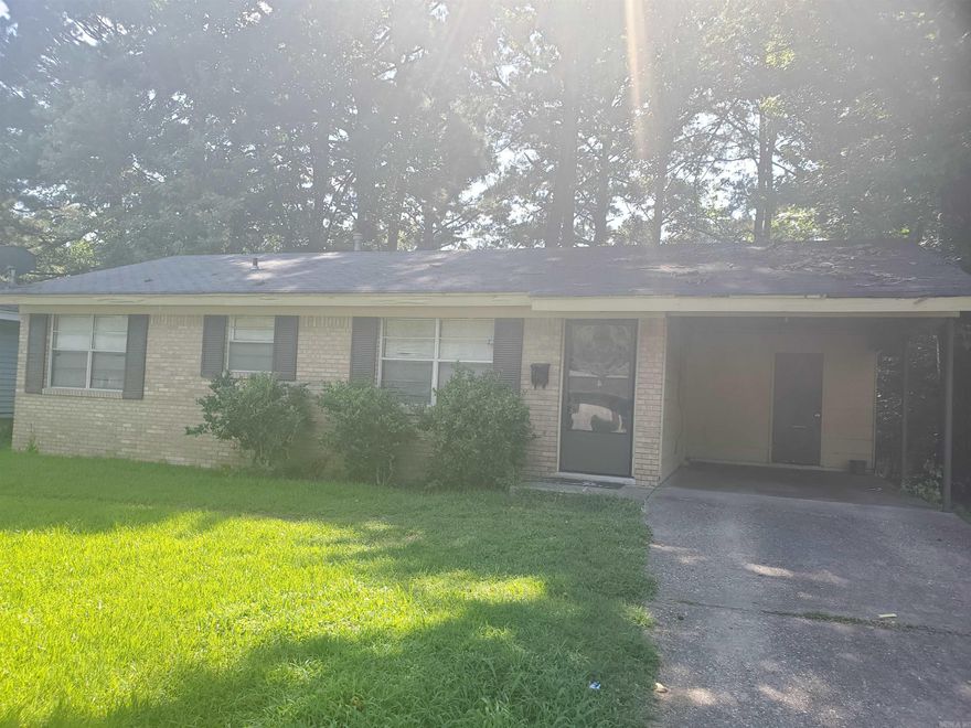 This home features three bedrooms and one and half baths, eat in furnished kitchen, carpet and hardwood laminate floors, fenced back yard, central heat and air, and two car carport.