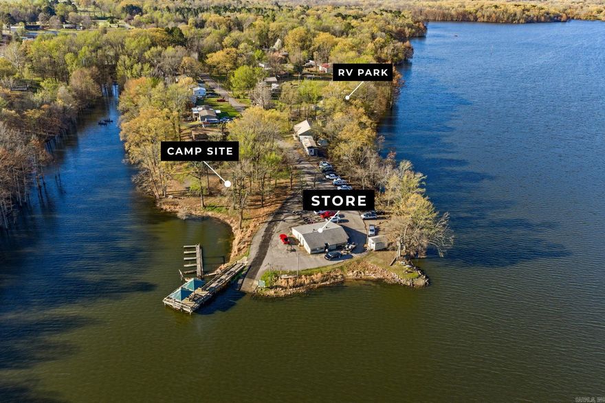 Welcome to Lucky Landing on Lake Atkins, a unique multi-parcel lake-area opportunity offering multiple income streams and long-term upside.  The marina store building offers approximately 1,936 square feet and is stocked with tackle, fishing gear, boating accessories, small motors, and additional retail inventory. The setup also includes a complete live bait system with dedicated bait rooms, tanks, and supporting equipment already in place.  Also included in the sale is a 14-site RV park with full hookups, along with a separate 5-site campground designed for self-contained RVs, providing flexibility for both short-term and extended stays.  The property benefits from its proximity to public boat docks and lake access managed by Arkansas Game and Fish Commission, attracting steady traffic from anglers, boaters, and outdoor enthusiasts.  With multiple components already in place and a location tied closely to lake activity, this is a strong opportunity for someone looking to reestablish or grow a lake-oriented business with several paths for income.