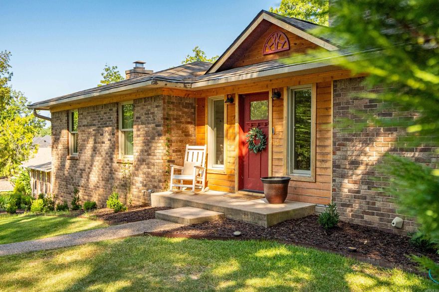 Welcome to your fully furnished lakefront escape! This beautifully renovated 3-bedroom, 2.5-bath home with a bonus room offers the perfect blend of comfort, style, and waterfront living. With approximately 99 feet of prime Lake Hamilton frontage, this spacious retreat features soaring cathedral ceilings and a light-filled living area that showcases stunning lake views.  A charming spiral staircase leads you to the downstairs bunk room—perfect for guests or kids—which also has private exterior access. Outside, the expansive deck is ideal for relaxing or entertaining, while a flagstone path takes you to a lakeside seating area and your private one-stall boat dock with a tanning platform.  Storage abounds, with built-in space under the deck for all your lake toys. The property also includes a detached two-car garage and an additional attached third garage, currently outfitted with a workbench and deep freezer—perfect for hobbies, tools, or extra storage.   Surrounded by mature trees on a large lot, this home is being sold fully furnished, so you can start enjoying lake life from day one. Don’t miss your opportunity to own this turnkey slice of paradise on Lake Hamilton!