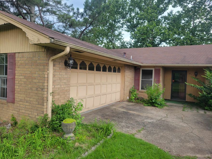 Large Lot. Home needs TLC. Lots of Cabinet Space. Fireplace in living room. Large shade tress in back yard.