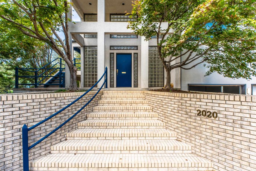 BOAT TO THE GULF - Wonderful opportunity to own waterfront property in the private gated community of Canal Pointe. Nestled along the river in the heart of Riverdale near walking/biking River trails, restaurants, golf courses, & entertainment. As you step into this contemporary home you are greeted by a stunning glass block entry, which takes you upstairs to an open living room, kitchen breakfast bar area & a fireplace. Floor to ceiling atrium windows along the back of the home provides lots of natural light & water view. Enjoy covered patios/deck on the rooftop with panoramic views of the canal & Arkansas river. Gas & waterlines are in place to create your own rooftop entertainment retreat. Rooftop will support a large hot tub. Features a 2 car garage with additional space for 3rd car or large workshop. A unique feature to this home is the dumbwaiter which helps you get the heavy groceries up to the kitchen from the garage. The 3 bedrooms feature views of the canal. Primary suite is located on the main level with the convenience of an en-suite laundry. Geo-thermal heating & cooling. Home is priced well below appraised value so new owner can update to make it their own.