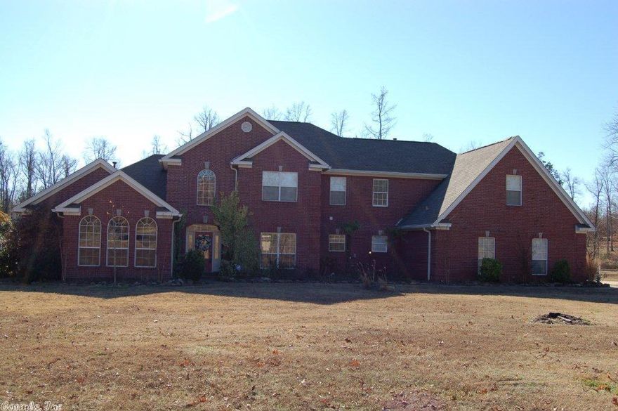 Spectacular home w/ plenty of space & privacy; natural light thru out!  Spacious eat-in kitchen w/ coffered ceilings, 5 burner gas stove, SS appliances, 2 convection built-in wall ovens.  Master has his/her walk in closets, huge jetted tub & walk in shower. Greatroom boast built-in's, cozy gas fireplace & French doors that open up to large covered back porch w/ outdoor speakers overlooking the salt water pool. Home sits on 6.18 acres, beautiful creek runs length of wooded back yard. See agent remarks