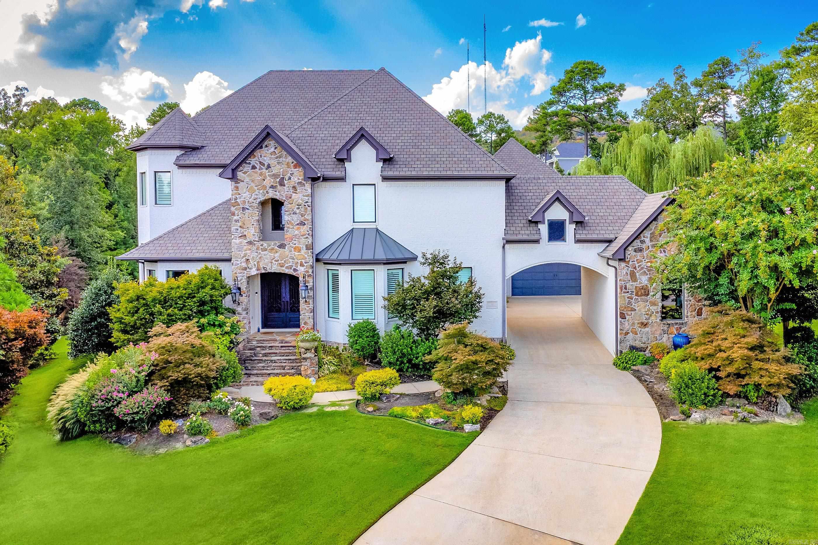 Situated on a beautifully landscaped lot in the coveted gated community of Deauville, this home offers luxury, comfort, and a perfect blend of indoor and outdoor living. Step inside to warm hardwood floors, soaring ceilings, and expansive windows that frame views of the covered outdoor living space, sparkling pool, lush gardens, and backyard pond. The perfectly designed floor plan includes: Great room plus both formal and informal dining areas, Chefās kitchen with high-end appliances, gorgeous new countertops, and a stylish backsplash Private study and separate office for ultimate work-from-home flexibility Luxurious primary suite with a sitting area, spa-like bath, and massive closet Main-level guest suite with access to pool and patio Theater room with wet bar, new seating, carpet, and screen Custom wine room for the enthusiast Upstairs: two spacious guest bedrooms with shared bath, an en-suite bedroom, and Additional highlights include: Three-car garage + golf cart storage Custom shades & plantation shutters Upgraded lighting and security system Added hardwoods throughout (no carpet) New pool heater, lights, and liner. Refined living at its best. COME SEE!!
