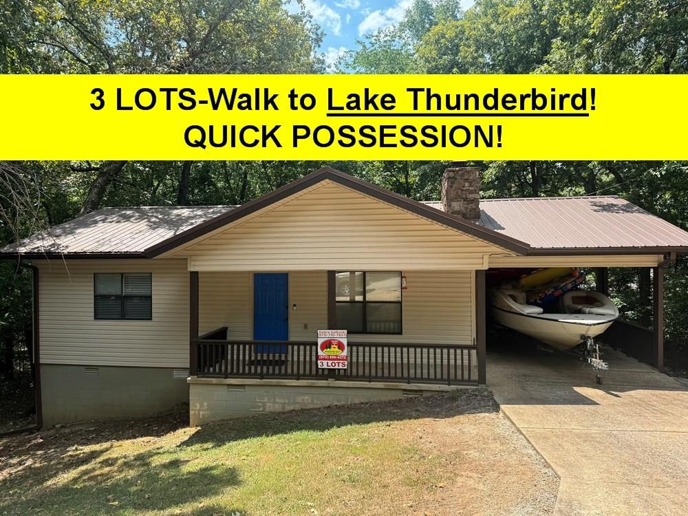 GREAT GETAWAY or VRBO-Walk to North Rec Center, access to pool (seasonally) hiking trail, fishing, play area for kids. 3 LOTS, great privacy yet walking distance to Town Center. Low maintenance (vinyl siding-metal roof-gutters) 2 bdrm 1 1/2 ba property move-in ready- Large primary bdrm. Furnishing are nego. Open living rm-dining rm-kitchen. Kitchen updated with solid surface counter tops, stainless range & refrig, oversized ss sink and garbage disposal. Laundry rm off kitchen includes washer & dryer and offers extra storage. Living rm features native stone wood burning fireplace w/blower. Coat closet. Neat tin ceilings thru-out offer a rustic feel- great wood looking vinyl floors for easy clean up. Dining area looks out to large newer deck- perfect for bbq- partially covered enjoy even in the rain! Great views of woods and wildlife. Insulation under floors as seen from basement- Security Alarm, also RING doorbell. Unfinished basement (reached from outdoors) houses water heater, & there is even a poured concrete slab that can be used for lots of storage or for a workshop. Attached carport- great to leave your boat, also exterior storage closet. Covered porch. Quick possession.