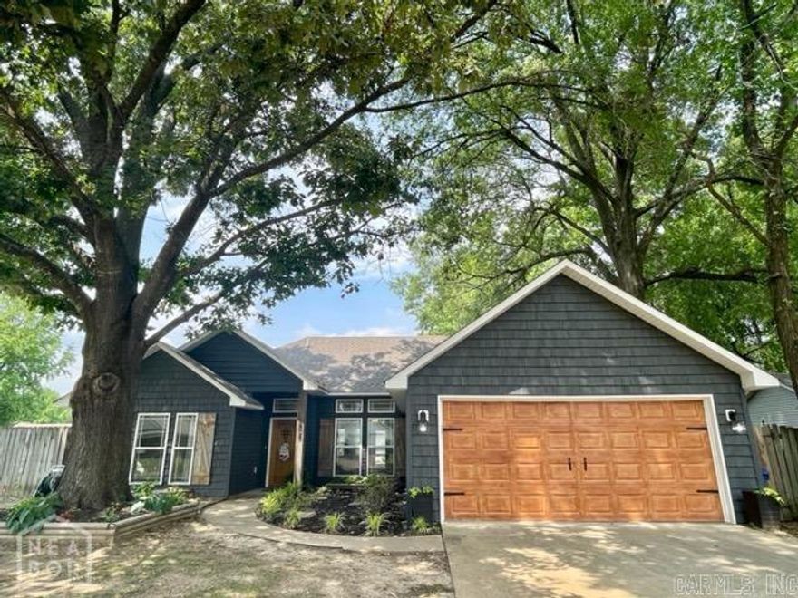 Well maintained 3-bed, 2-bath home on a spacious corner lot in the heart of Jonesboro! This 1,604-sqf. home features good-sized bedrooms with built-in shelving in closets, a large walk-in closet in the master suite, and a bright welcoming living area. This functional floor plan includes a dedicated laundry room/mudroom off the 2-car garage, plus a floored attic for extra storage. With great curb appeal and a warm, cozy feel, this home blends comfort and practicality in all the right ways. Conveniently located near schools, shopping, and local amenities. This one is easy to love and is move-in ready!