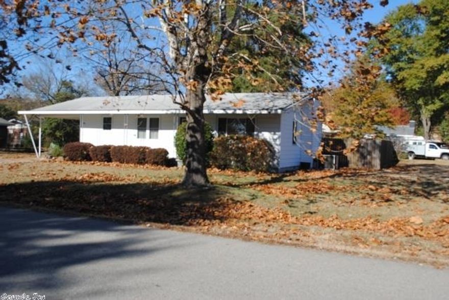 Floorplan has kitchen, dining, living room open and completely across front of house.  One bedroom on each side of back of the house, new bathroom. New kitchen.  Hardwood flooring, fenced back yard.  Shed.  Corner lot.  Maintenance from exterior.