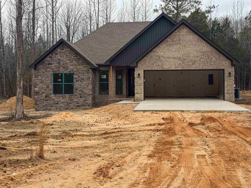Welcome home to this stylish new construction nestled in a peaceful country setting just minutes from Brookland! Featuring 3 bedrooms and 2 baths, this thoughtfully designed home offers an open floor plan perfect for modern living. Interior highlights include durable LVP and ceramic tile flooring, solid-surface countertops, custom closets, and an upgraded appliance package that makes the kitchen shine. The exterior features a beautiful combination of brick and vertical siding for standout curb appeal. Enjoy quiet evenings on the covered back porch while staying close to the conveniences of town. Located in the desirable Greene County Tech School District. Seller Property Disclosure, Plat & Legal Description available in Assoc. Docs.