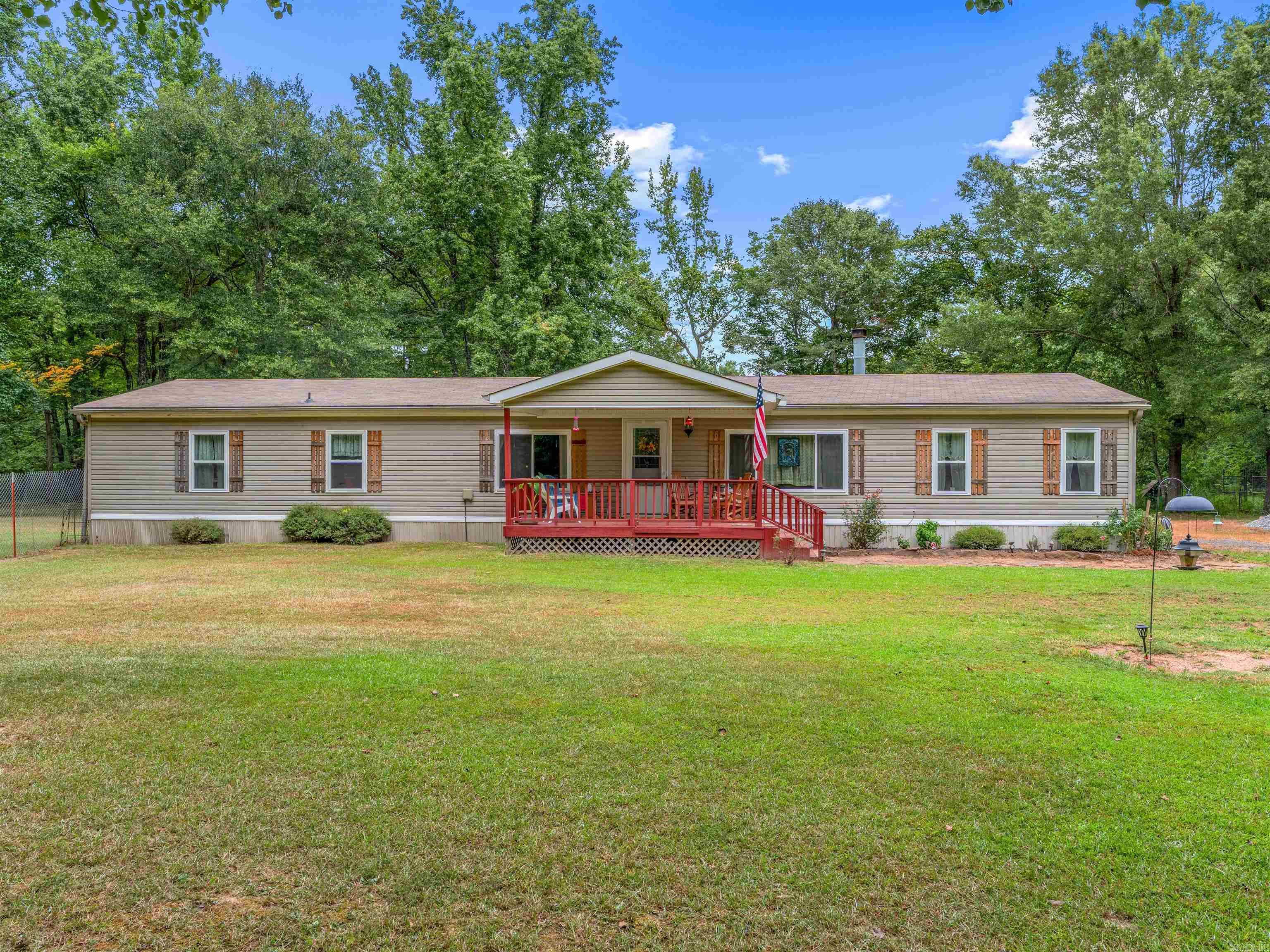 Discover 12 acres of peace and privacy just minutes from town in the highly sought-after Cabot School District. This beautiful property offers a little bit of everythingārolling pasture, food plots, a .5-acre stocked pond, a creek, and abundant wildlife for the avid hunter or nature lover. The well-maintained manufactured home sits on a permanent foundation and features inviting spaces including in-law quarters with a spacious master bath, walk-in shower, a charming clawfoot tub and a screened in porch. Relax on the front porch while enjoying the view of deer and turkey right in your backyard. A detached 30x50 insulated garage with AC, electric, ceiling hoist, half bath, and welding setup provides the perfect workshop. Updates include new gravel in the driveway, new windows in 2024, roof in 2021, and hot water heater in 2019. Extra storage is easy with the shed and lean-to, and the refrigerator stays! A rare opportunity to enjoy country living with convenience to townādonāt miss it!