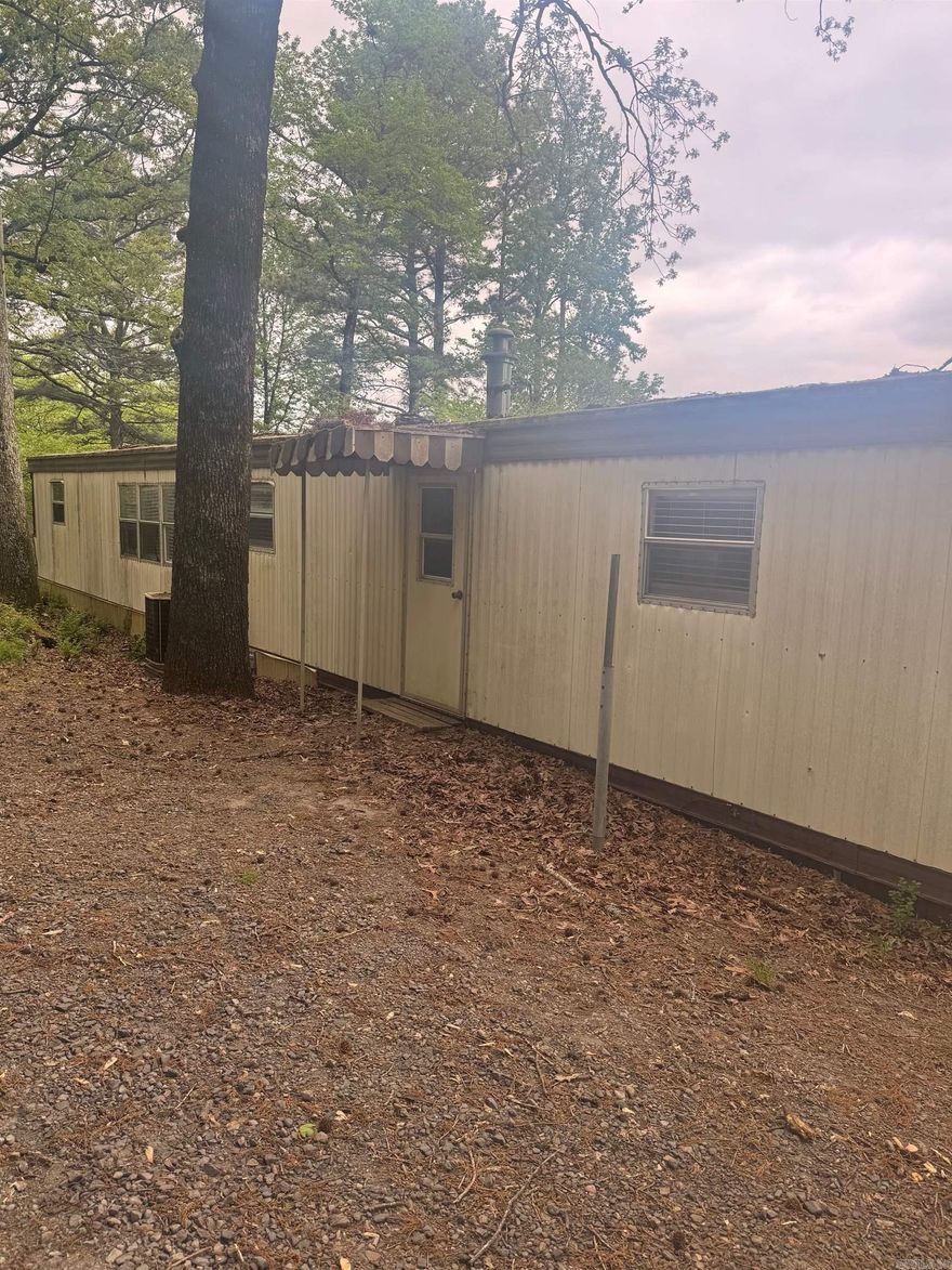 Mobile home for rent 700 per month with a 1 year lease and Deposit of 700. Mobile home is in good condition in a quite area right outside of the city limits but less than 10 min to I430, I630, I30, and I40. A nice 2 bed 1 1/2 bath with new floors and spacious living and open kitchen area. Washer/dryer hookups in unit. This one wont last long.