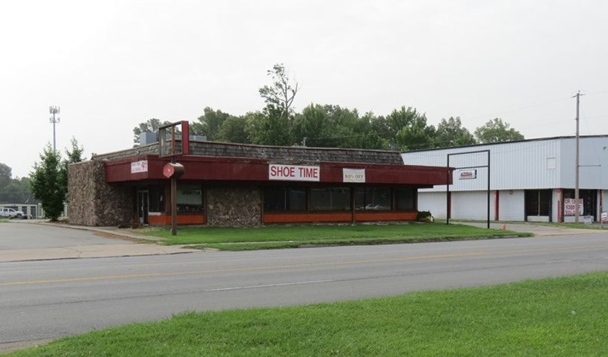 Great commercial property, highly visible location on busy street,  Building has lots of windows, glass doors, 2 bathrooms, retail space, back office, and storage.  Paved area all the way around the building.  Age of building is estimated from tax records.  Call today to view this property. ** Agents see remarks**