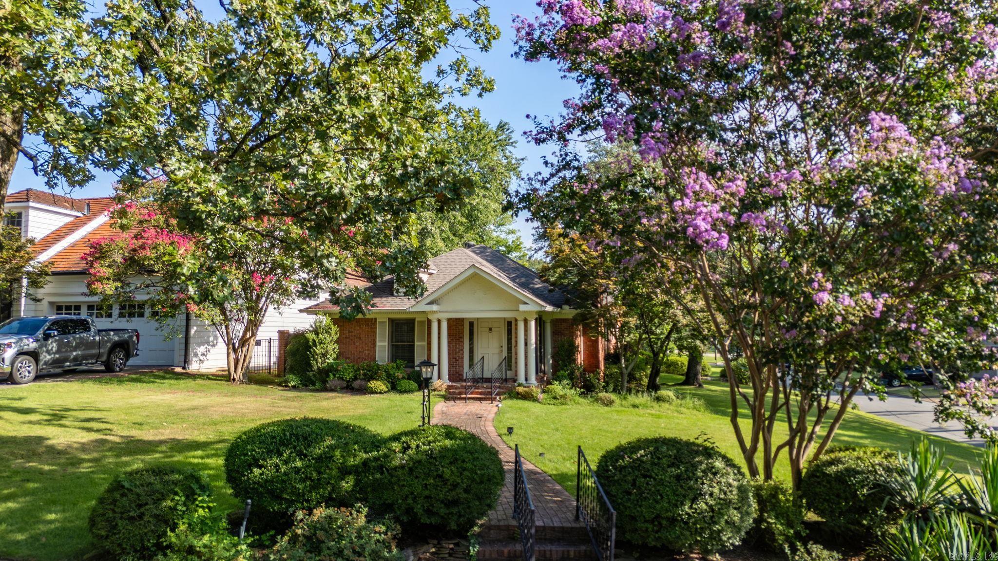 One level Heights home with a two car garage on the corner of Country Club Blvd and Van Buren Street. This home has two bedrooms with the primary bedroom having a large walk in closet that holds the laundry which is super convenient. Oversized primary bath with double vanity and marble floors. There is a nice sized office with french glass doors overlooking the backyard. Formal living room as you walk in the front door with a gas log fireplace. The kitchen flows nicely into the large family room in the back of the house. This family room has tall ceilings and a fireplace and a wall of windows and doors overlooking the backyard. Cute backyard with a beautiful pond. Oversized garage with ample storage above. This lot can become 65 feet buildable across if a 15 foot section on the east side is purchased from the city.