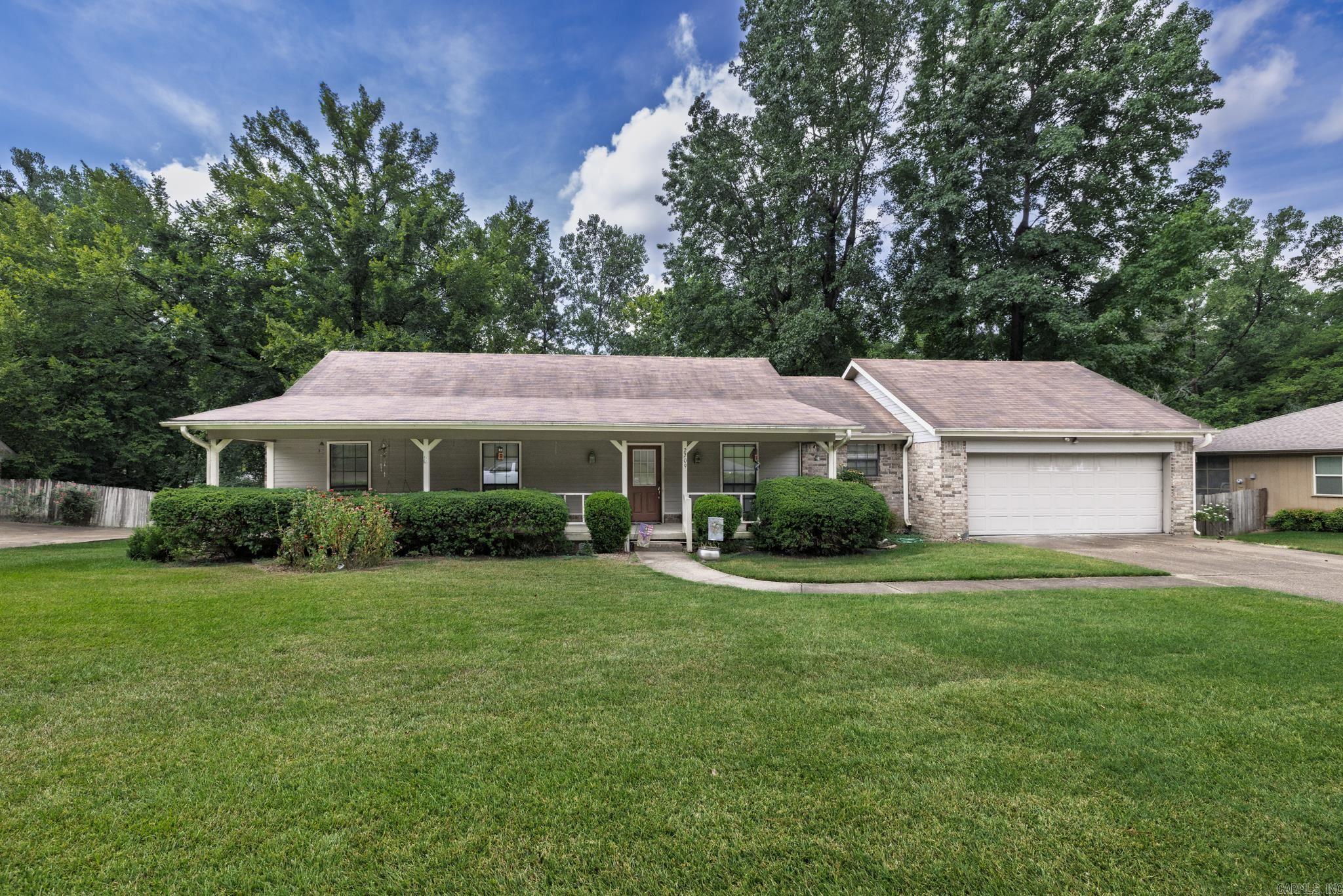 Nestled on an oversized lot in Arkadelphia, Arkansas, this charming 3-bedroom, 2-bath home is loaded with livable space and future potential. Enjoy multiple outdoor living areas, including a huge front porch perfect for morning coffee, a screened-in porch for bug-free evenings, and a back deck overlooking the fully fenced backyardāideal for pets, play, or a garden. Inside, the cozy living room centers around the brick fireplace, creating a warm gathering spot on cool nights. With its comfortable layout, generous lot size, and room to update or personalize, this property offers the perfect blend of move-in-ready comfort and opportunity to make it truly your own. Schedule your showing today! Agents see showing remarks.