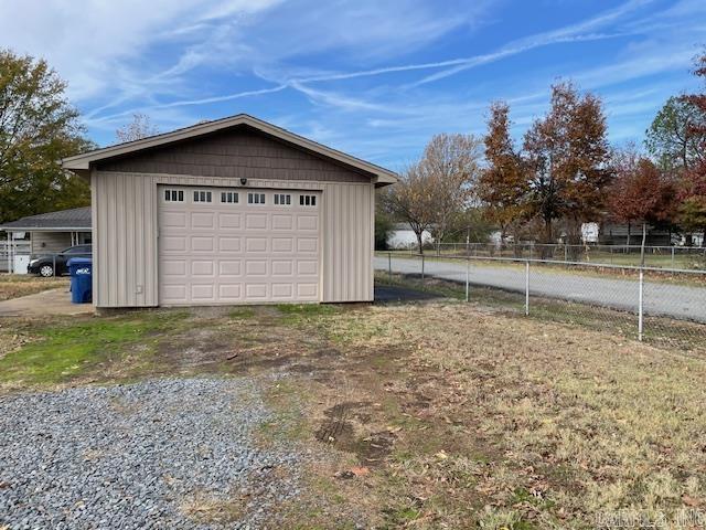 Nice insulated 600 sq. ft. shop sitting on 2 lots with a chain link fence on the property. Shop has concrete floor. Water and gas are available. Shop is even wired with 220 voltage. Located inside the city limits.