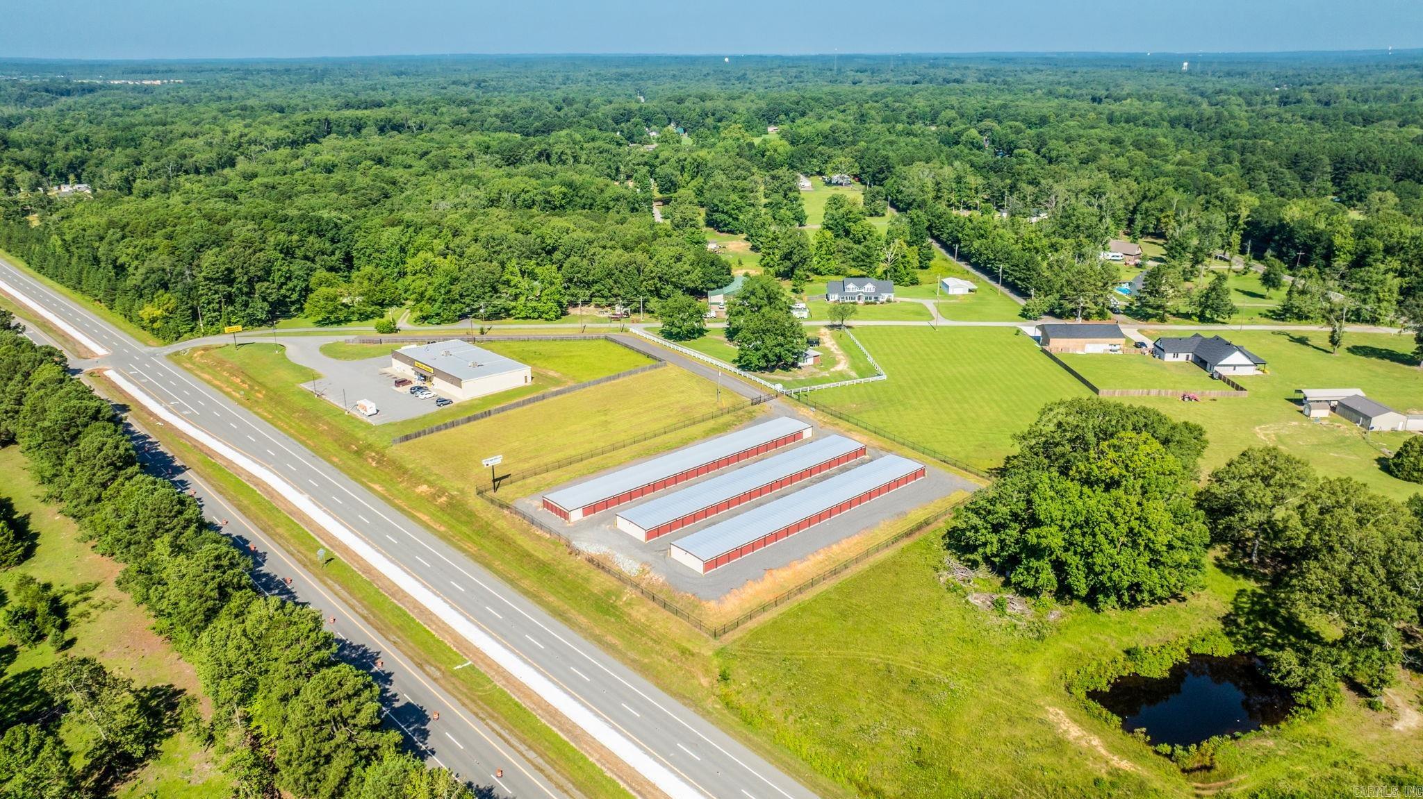 Prime Self-Storage Investment Opportunity with Expansion Potential | High-Visibility Asset in Booming Saline County, AR Unlock a rare opportunity to acquire a newly built 138-unit, 19,500 SF self-storage facility in the heart of fast-growing Saline County, Arkansas. Strategically positioned along a high-traffic corridor with premium highway frontage, this property offers unbeatable visibility and ease of access, making it a standout investment in the regionās thriving storage market. Investment Highlights 19,500 SF across 138 units with a strong occupancy history and consistent cash flow Prime highway frontage ensures maximum visibility and drive-by traffic Additional acreage included, ideal for expanding unit count, adding climate-controlled storage, or RV/boat parking Fully fenced with gated access and security features in place Strong Future demand in an area experiencing strong residential and commercial growth Location Highlights Situated in Saline County, one of Arkansasās fastest-growing counties, the property benefits from close proximity to Benton, Bryant, and the Little Rock MSA. This area continues to see new residents and commercial developments.
