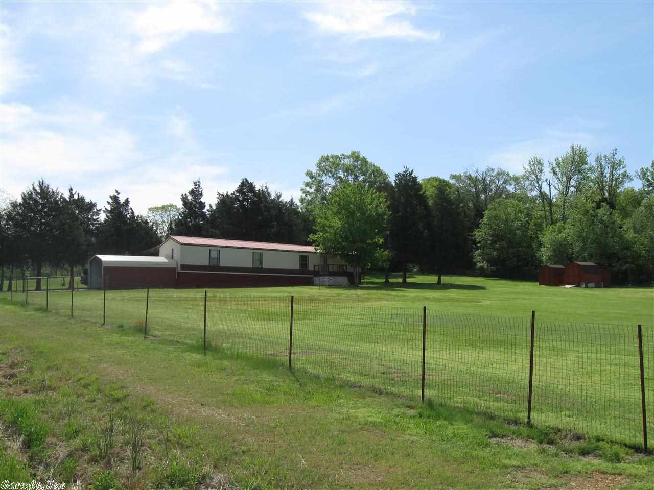 Mobile home and 1.2 acres in subd. 3 outside storage buildings.