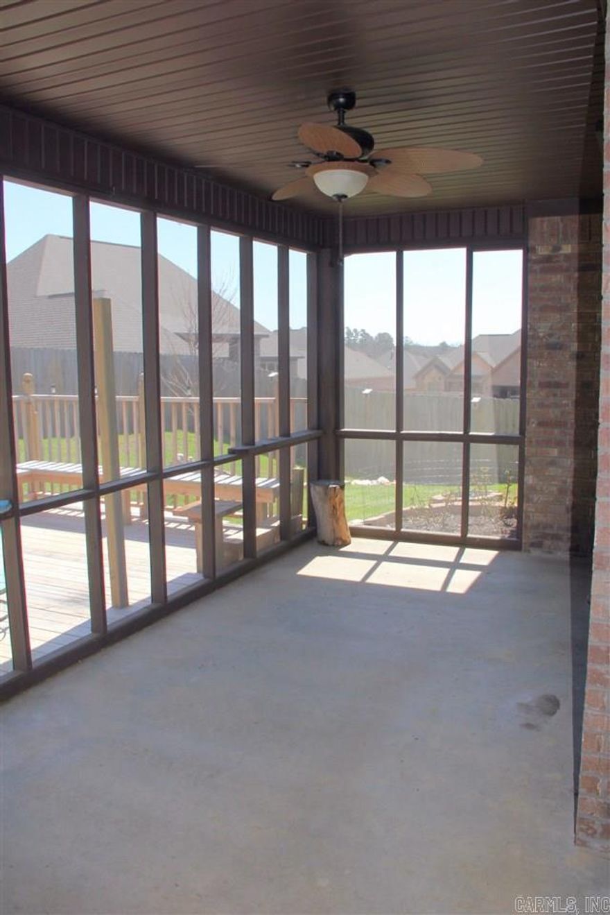 Beautiful newer brick home in Remington Place. 10/12 ft ceilings, Hdwds and WB fireplace w large granite mantel. Kitchen features custom granite, 16' tile, & SSA.  Custom trim, crown and tray ceilings. Xtra large shower/jetted tub. Screened porch on just over half acre. Large 12/29 ft wooden deck. Xtra wide driveway. Fully fenced w/2 gates. Seamless gutters. Close to expressways/shopping. Energy efficient. Digital locks. Extra flooring in attic. Well Maintained/move in ready. Show today! see remarks