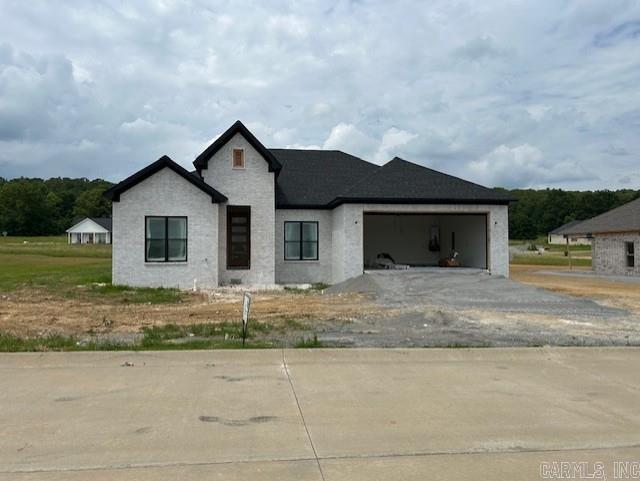 Beautiful new construction home with a great layout that encourages gathering. Tall ceilings in the entryway lead to an open floor plan that showcases the beautiful living room, kitchen and dining room. A gas fireplace anchors the living room with built-ins on either side. Large kitchen island. The kitchen also features a gas stove, beautiful countertops, and a pantry. Split floor plan with two extra bedrooms apart from the primary suite. Primary suite boasts a large closet that connects to the laundry room. Custom tile shower with glass door in primary suite. Separate bath tub. Covered back porch with good sized back yard. Mud room with custom locker. Great location with easy access to Conway, I-40, and the Little Rock Air Force Base. Agents, see remarks.