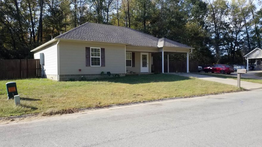 Perfect for 1st time home buyers!  RD/FHA/VA.  This adorable 3BR/2BA is located on a quiet street w/no thru traffic.  It was updated less than a year ago.  New faux wood ceramic tile throughout; laid in a stylish herringbone pattern.  Fresh paint, granite counters, custom tub & shower enclosures, light fixtures & more!  Spacious floorplan.  Big, fenced back yard.  Concrete pavers in back are covered by a wood parabola; great spot for outdoor entertaining!  Don't miss out.. both the storage building & refrigerator conveys with property!  Call to schedule a showing today.