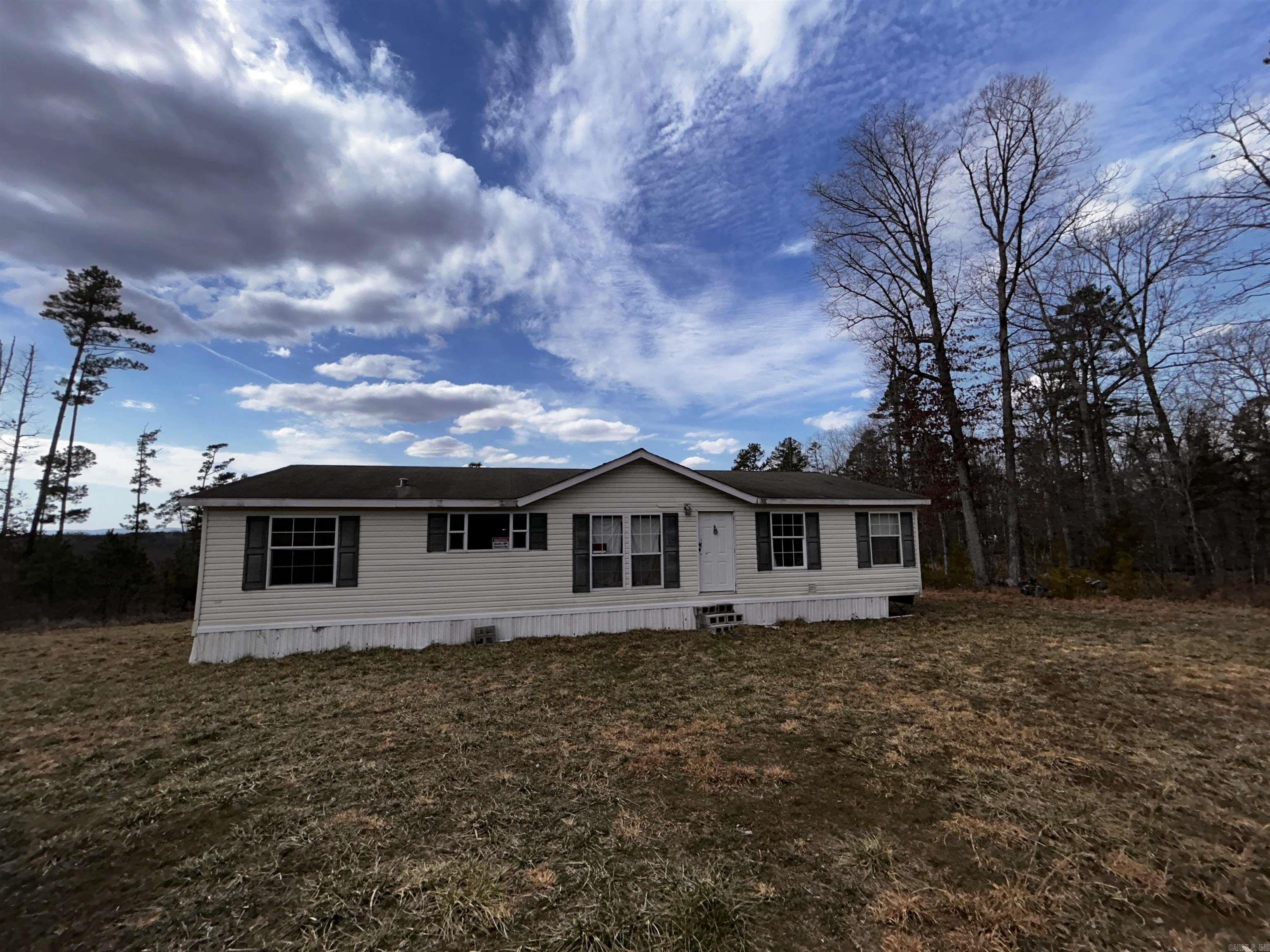 Panoramic Vista Views for Miles and Miles on this 20 acre Mountain Top property featuring a 3 bed 2 bath Doublewide. A little TLC and this could be your perfect home! 8 miles from Dillard's put in on the Beautiful Buffalo River. Make this your little slice of Heaven! This property has no well or septic or HVAC. Agents see remarks