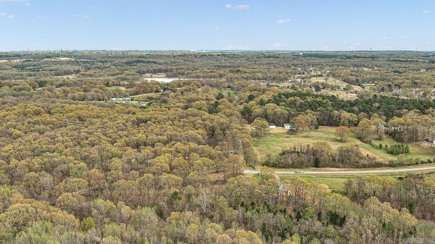 Nestled on 18 pristine acres of lush, wooded terrain, this exceptional property offers an unparalleled opportunity for those seeking both serenity and proximity to modern living. Tucked adjacent to one of Jonesboro, Arkansas’s most prestigious housing developments, this expansive parcel provides a rare blend of natural beauty and convenience. Towering trees and gentle topography create a peaceful backdrop, ideal for creating a private retreat or developing a distinguished estate. This property’s unique location ensures easy access to the best amenities in Jonesboro while maintaining the tranquility and seclusion of a rural setting. With its ample space and breathtaking surroundings, the land is perfectly suited for a visionary homeowner or investor looking to capitalize on one of the area’s most coveted locales.