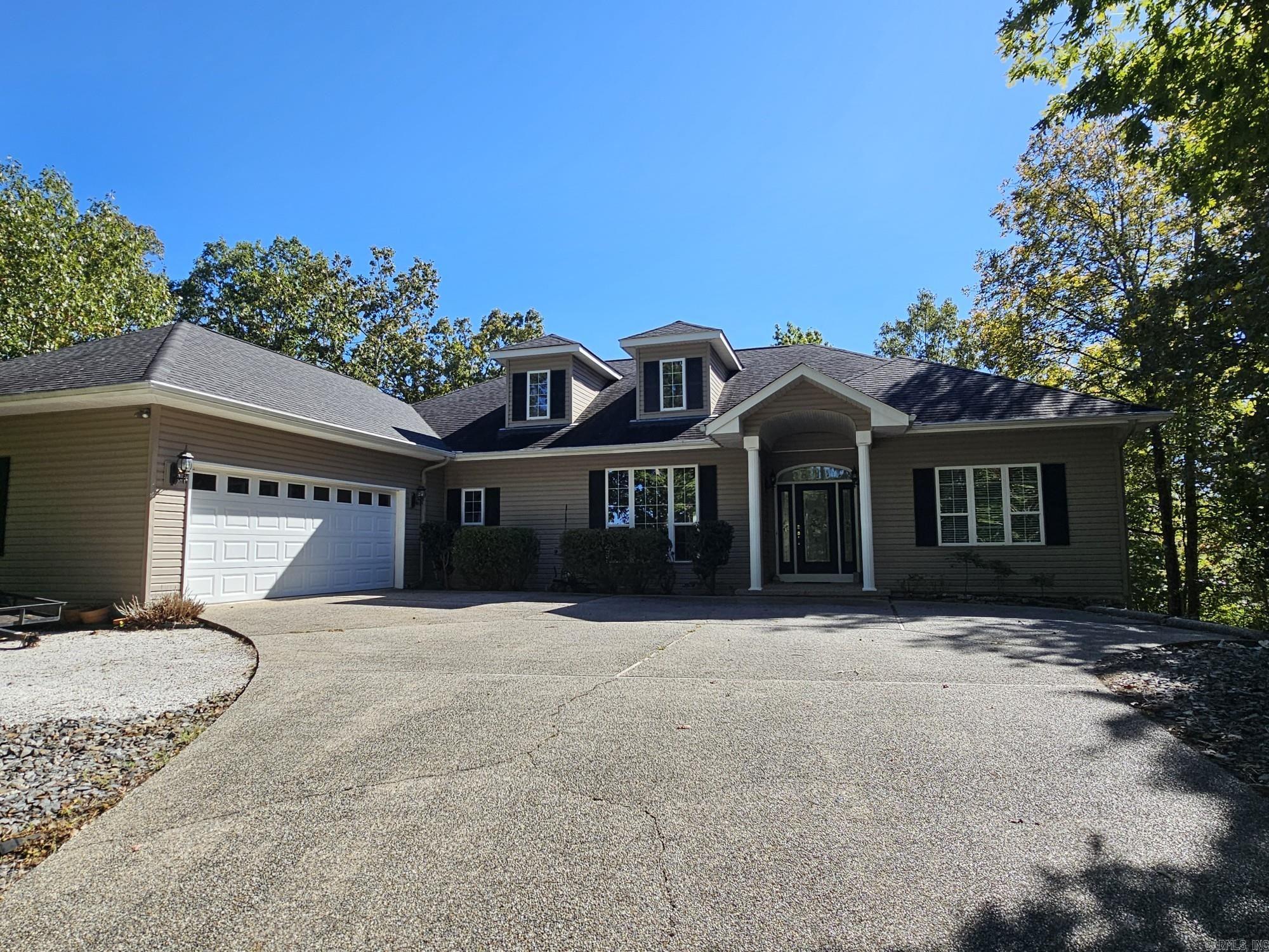 Move-in ready and priced to sell at $395,000, this 2,649 sq. ft. Magellan golf course home built in 2004 offers high-volume ceilings, a spacious sunroom, and a cozy gas fireplace for year-round comfort. The kitchen features granite countertops and includes a refrigerator, while wood floors and carpet add warmth and style throughout. With 3 bedrooms, 2.5 baths, and low-maintenance features like a recently replaced decking and a roof updated around 2016, this property blends style and practicality in a serene golf-side setting.