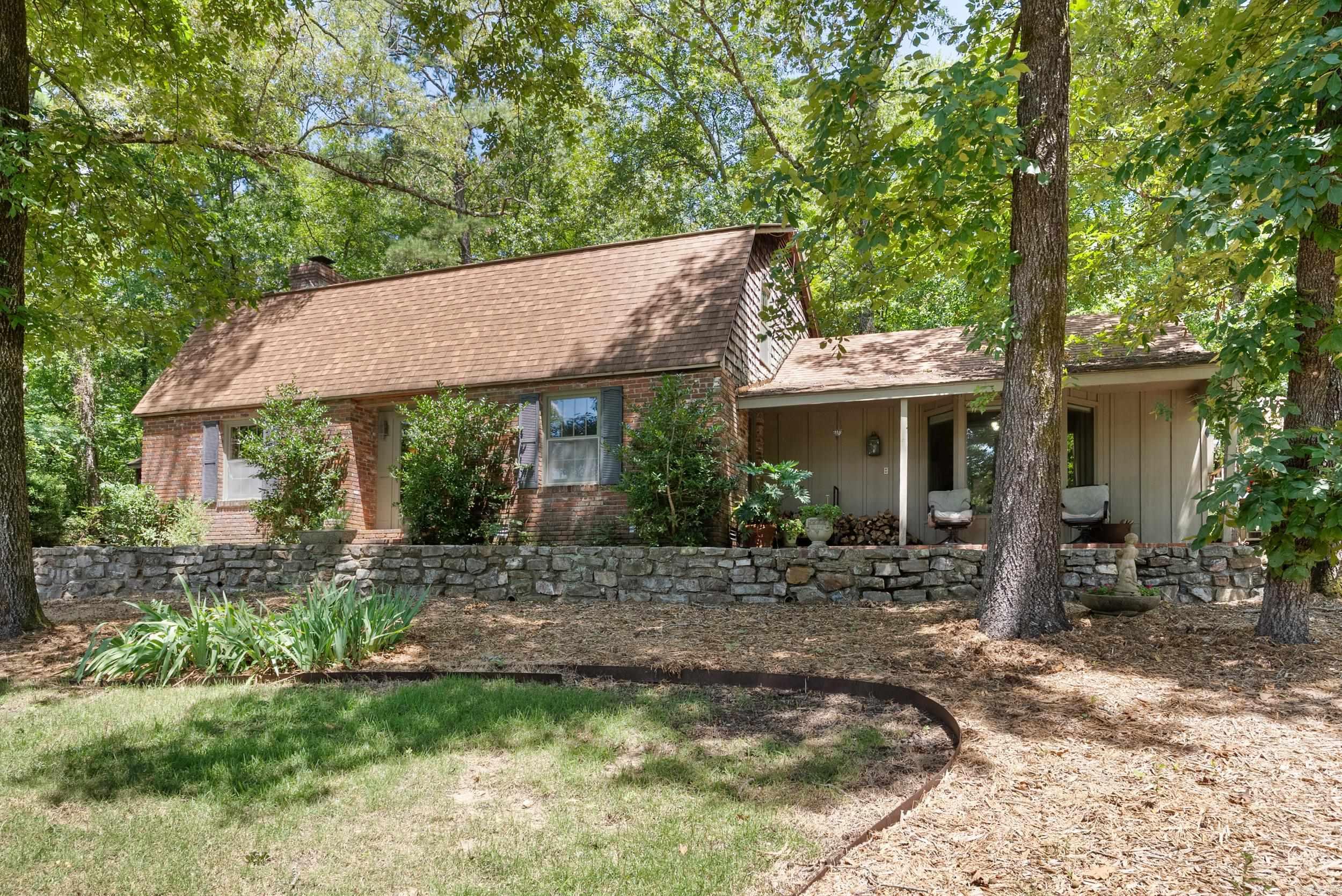 Tucked just steps from Lake Hamilton in a quiet cove near Garvan Woodland Gardens, this charming Cape Cod-style retreat sits on approx. 2.5 acres and offers endless potential. With 5 spacious bedrooms and 3 bathrooms, it's ideal for large families, corporate retreats, or a short-term rental investment. Inside, enjoy rich wood finishes and warm, inviting spaces. Sip coffee or cocktails year-round from the oversized front porch with lake views, or unwind in the private back patio surrounded by nature. The property includes a massive detached garageāperfect for RVs, boats, hobbies, or car collections. The surrounding acreage can be subdivided and developed, with incredible lakeview potential for additional STRs. Two adjacent lots are available for separate purchase, and furnishings can convey to make this a turnkey opportunity. Whether you're looking for a full-time residence, a family getaway, or a high-income rental setup, this unique lakeside property checks every box. Agents see remarks.