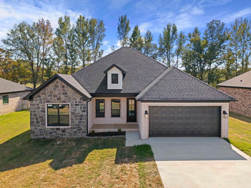 Beautiful new construction in Copper Moon Estates! This 4 bedroom, 2 bath home offers 1,830 sq ft of stylish living space with tall ceilings and an open layout. The kitchen is designed for function and flair with granite countertops, pantry, breakfast bar and stainless appliances, flowing seamlessly into the family room with a cozy wood-burning fireplace. Luxury vinyl plank flooring runs throughout—NO CARPET! The private primary suite includes a spacious walk-in closet, double vanity and walk-in shower. Built with efficiency in mind, this home features walls spray foam insulation, air duct foam insulation, Low-E windows, radiant barrier roof, & higher efficiency air conditioning. Outside, enjoy a covered patio and fully fenced yard, plus a two-car garage. Sitting on a .31-acre lot in the Cabot School District, this home is close to schools, shopping and minutes from nearby highways. Schedule your showing today! Don't miss the opportunity to call this new home yours!