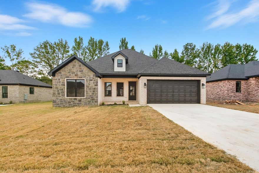 Beautiful new construction in Copper Moon Estates! This 4 bedroom, 2 bath home offers 1,830 sq ft of stylish living space with tall ceilings and an open layout. The kitchen is designed for function and flair with granite countertops, pantry, breakfast bar and stainless appliances, flowing seamlessly into the family room with a cozy wood-burning fireplace. Luxury vinyl plank flooring runs throughout—NO CARPET! The private primary suite includes a spacious walk-in closet, double vanity and walk-in shower. Built with efficiency in mind, this home features walls spray foam insulation, air duct foam insulation, Low-E windows, radiant barrier roof, & higher efficiency air conditioning. Outside, enjoy a covered patio and fully fenced yard, plus a two-car garage. Sitting on a .31-acre lot in the Cabot School District, this home is close to schools, shopping and minutes from nearby highways. Schedule your showing today! Don't miss the opportunity to call this new home yours!