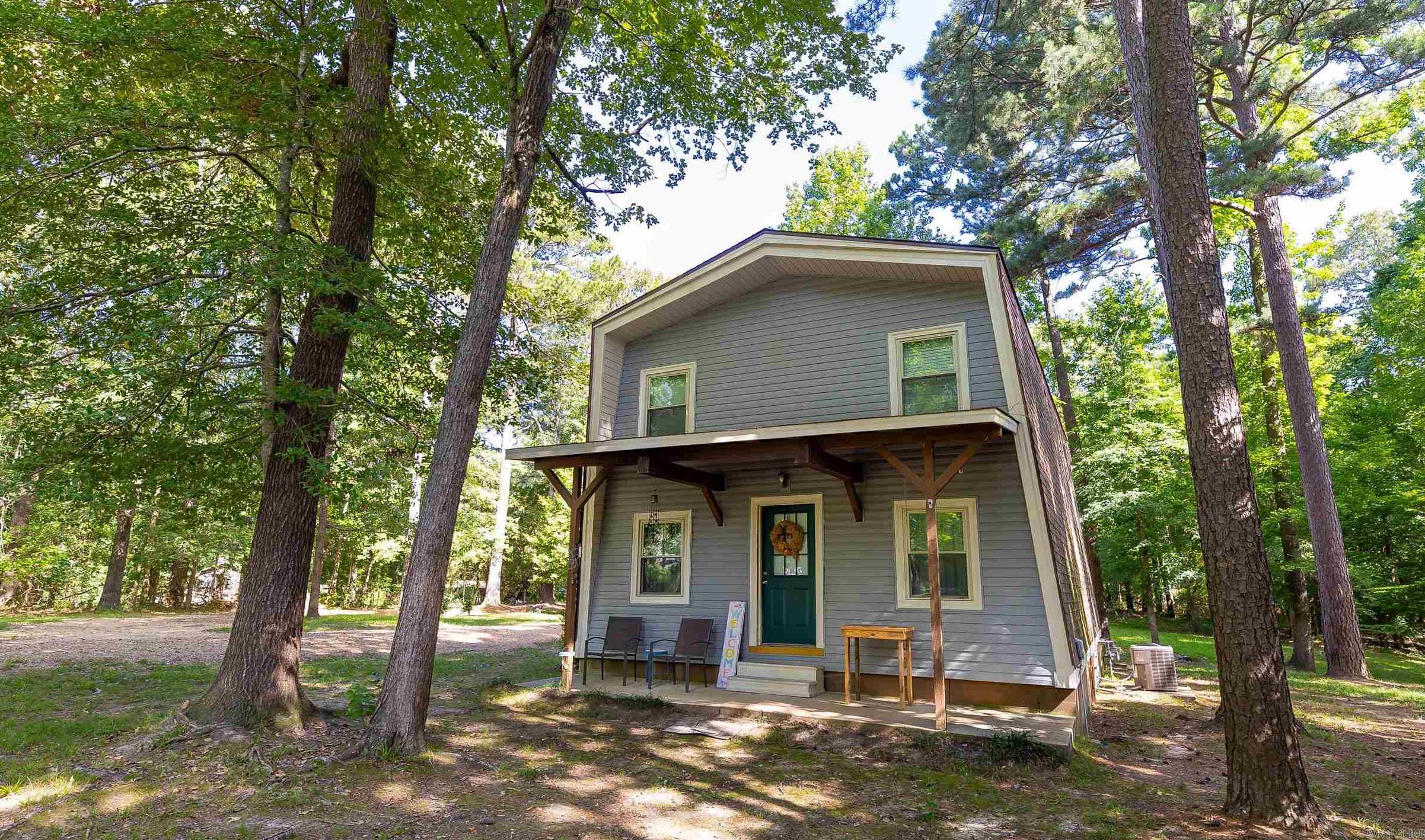 Welcome to your dream retreat! This A-frame style cabin sits on just over 1.5 acres outside the city limits, offering the perfect blend of peaceful country living with the convenience of being just minutes from town. With 3 bedrooms and 2 full bathrooms, this home has room to spread out while still feeling cozy and inviting. At the heart of the home is a custom kitchen island, complete with stone countertopsāperfect for cooking, entertaining, or gathering with loved ones, that also connects to the large living room. Enjoy the outdoors year-round with a spacious covered carport, plenty of yard space for kids or pets, and scenic views in every direction. Whether youāre sipping coffee on the porch or stargazing at night, this is country living at its finest. No city restrictions, tons of character, and the charm of an A-frame designāthis property is a rare find. Donāt miss your chance to make it yours.