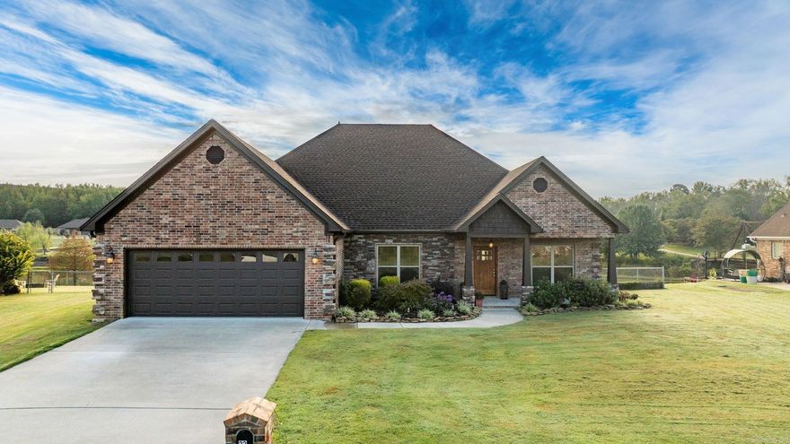 Impeccable lakefront home with private dock and stunning views! Make this Your dream Lakefront Retreat. This beautifully maintained 4 bedroom 2 1/2 bathroom home is situated on a premium lakefront lot with a private dock offering breathtaking water views and a tranquil lifestyle. Inside you'll find luxury vinyl plank flooring throughout with no carpet for a clean modern look and easy maintenance. The gas log fireplace with gorgeous stone surround creates a cozy focal point in the living area. The spacious kitchen is a chef's delight featuring a gas cook top stove, pantry and ample counter space. Perfect for entertaining the primary suite boasts a large tiled shower separate soaking tub generous walk in closet for maximum comfort. Enjoy outdoor living in the fully fenced backyard with direct lake access and your own dock ideal for boating, fishing or simply relaxing by the water. Home also features a full lawn and landscaping sprinkler system to keep the yard looking great. You will love that the home comes with a natural gas grill piped from the home. The garage is fully insulated and is heated & cooled with a Daikin mini split! Turn your garage into a year round work space.