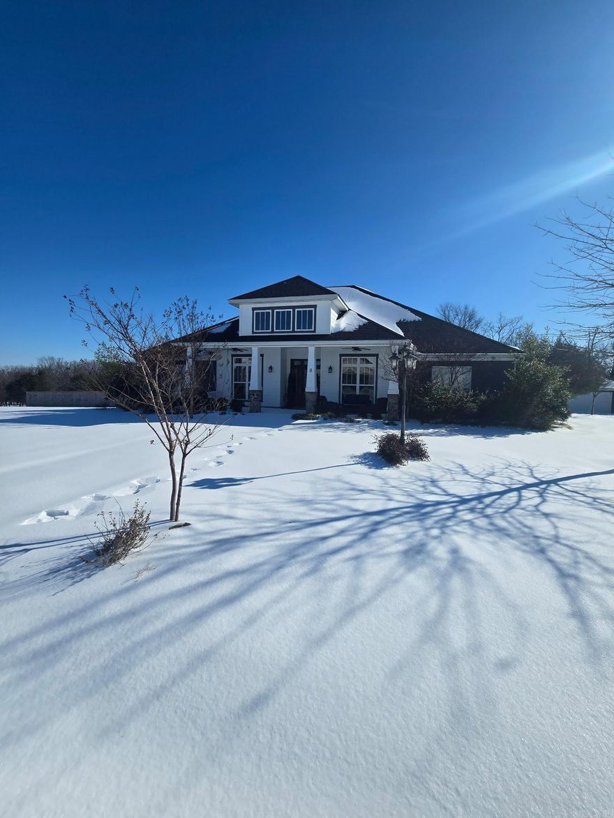 Welcome to Persimmon Ridge Estates located 4 miles northeast off Hwy 65 near  one of Arkansas' popular Disc Golf Course and Wooly Hollow State Park. This home sits on a flat lot and backs up to 100+ wooded acres for privacy. The craftsman style home with it's long front porch seems to be calling you to have a glass of sweet tea and stop to really enjoy the important moments in life. On one side of the entry you'll find a formal dining room and the other a nice office with french doors for privacy.  The open concept showcases a wall of windows in the living room and breakfast room looking out onto the full length covered back patio. The kitchen has all the latest design with a full breakfast bar, farmhouse sink and ceiling height cabinetry with glass lighting to accent your special dining collectables. The master suite also has the same expansive view into the woods where you will find yourself spying on a family of deer who venture up every year. Almost the entire one acre lot has a nice new privacy fence. The property also offers a detached two car garage or shop. This custom built home is pristine and a perfect example of southern design.