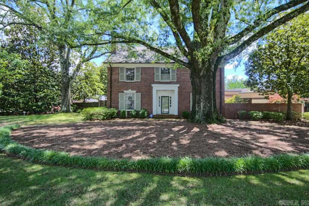 Stately family home on a large corner lot. elegant proportions define the living and dining rooms. Spacious kitchen and large den. Five bedrooms up. Huge floored attic. Handy workshop area.Nice rear yard and brick patio surrounded by brick wall. Property to be sold AS IS. See Agent Remarks...