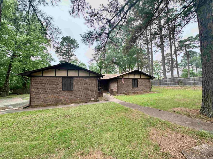 Put your own style into the great bones of this ALL brick home! This home sits on over a half acre lot that has a beautiful creek and trees and is partially fenced and has a storage building. Large bedrooms and a huge sunroom off the living room. NEW Water heater. Price and sq ft from recent appraisal. AGENTS PLEASE SEE REMARKS.