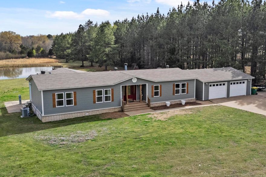 This property has everything!  Home features 3 bedrooms and 2 baths with a split floor plan.  Primary bedroom and bath are very spacious with a Jacuzzi tub, walk-in shower and large closet. The eat-in kitchen has stainless steel appliances, lots of cabinets and butcher block countertops. Living room has a corner stone fireplace and hardwood floors. All new windows and siding.  Age of roof and AC outside unit are 8yrs. The 2 car detached garage is beside the house and is oversized.  41x50 shop has water and electricity (heat/air possible).  There is a fenced pasture with shed for your livestock, a stocked pond with dock for fishing and a chicken coop.  The property is a perfect rectangle and has a concrete driveway from the shop to the house. Make your appointment to check this one out.  Located about 10 minutes from the back of the Air Force Base.