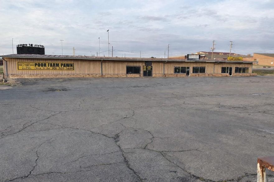 Excellent investment opportunity featuring a multi-tenant commercial building with strong visibility and ample parking. This single-story property offers multiple storefronts with established tenants, prominent signage, and easy access from a high-traffic roadway.  The property includes a large paved parking lot, durable metal exterior, and long-term income potential. Ideal for investors seeking cash flow or owner-operators looking to occupy one unit while generating income from the others.  Prime location with strong exposure and steady surrounding traffic. Don’t miss this chance to add a performing commercial asset to your portfolio.