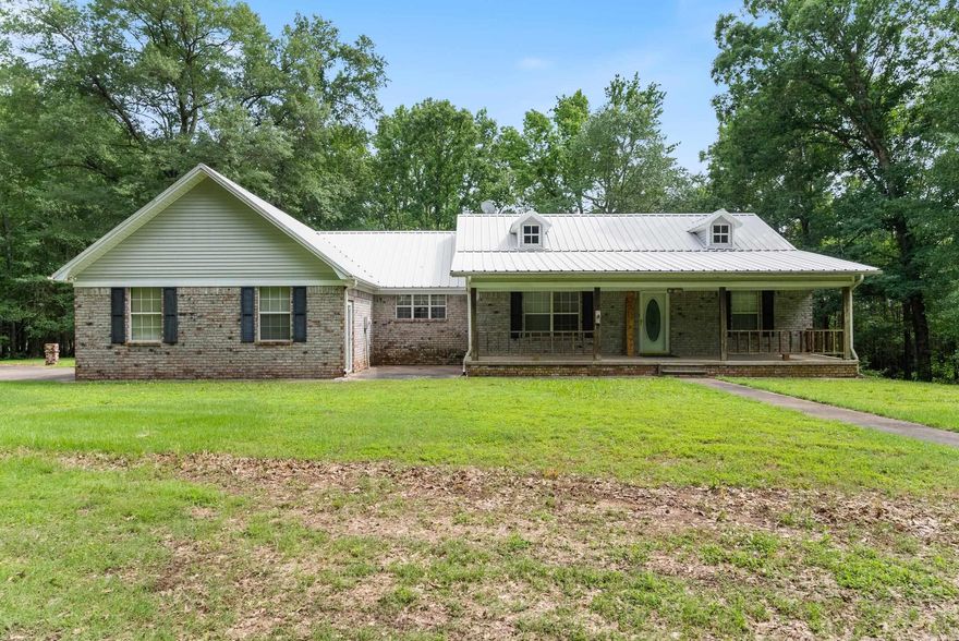 RARE FIND – COUNTRY LIVING JUST MINUTES FROM TOWN! Located just 5 miles outside of Conway, this unique property offers the perfect blend of peaceful country living with the convenience of city amenities—you're just minutes from Sam’s Club and more! This spacious 2,192 sq. ft. home sits on approximately 4.10 acres and features a 2-car garage plus an additional 1-car garage attached to the home. You'll love the added value of a massive 40x60 shop, a detached carport, and a storage shed—plenty of room for hobbies, tools, or extra vehicles. Step inside and imagine the potential, with an approx. 1,450 sq. ft. unfinished basement offering endless possibilities for expansion, a game room, home office, or guest suite. Updates include a new HVAC system (within the last year) and a hot water heater replaced 2 years ago. Enjoy the outdoors under the shade of mature pecan trees, relaxing on the welcoming front porch. Being sold AS-IS — a great opportunity to add your personal touch and build equity. Agents: Please see remarks.