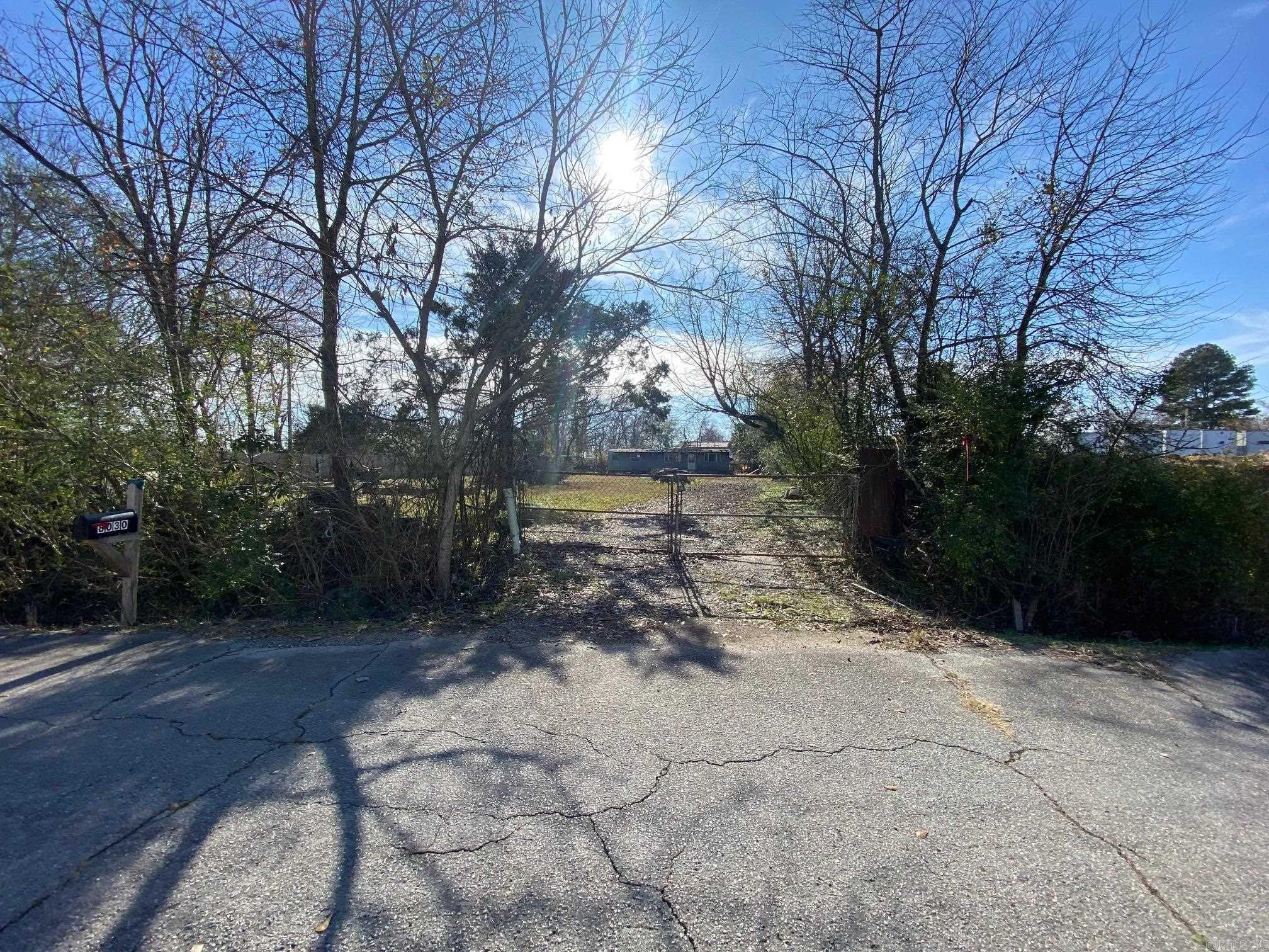 PERFECT location for an industrial property in the heart of North Little Rock!  Plenty of room for storing large equipment or building a shop.  Lot is cleared and is fully fenced, with a new privacy fence on the left side, farm fence in the back and on the right side, and a chain link gate in front for security.  Electrical pole has been dropped and is ready to go.  Mobile home to convey at no value or seller will remove with an acceptable offer.  Property is AS-IS.  Agents see remarks!