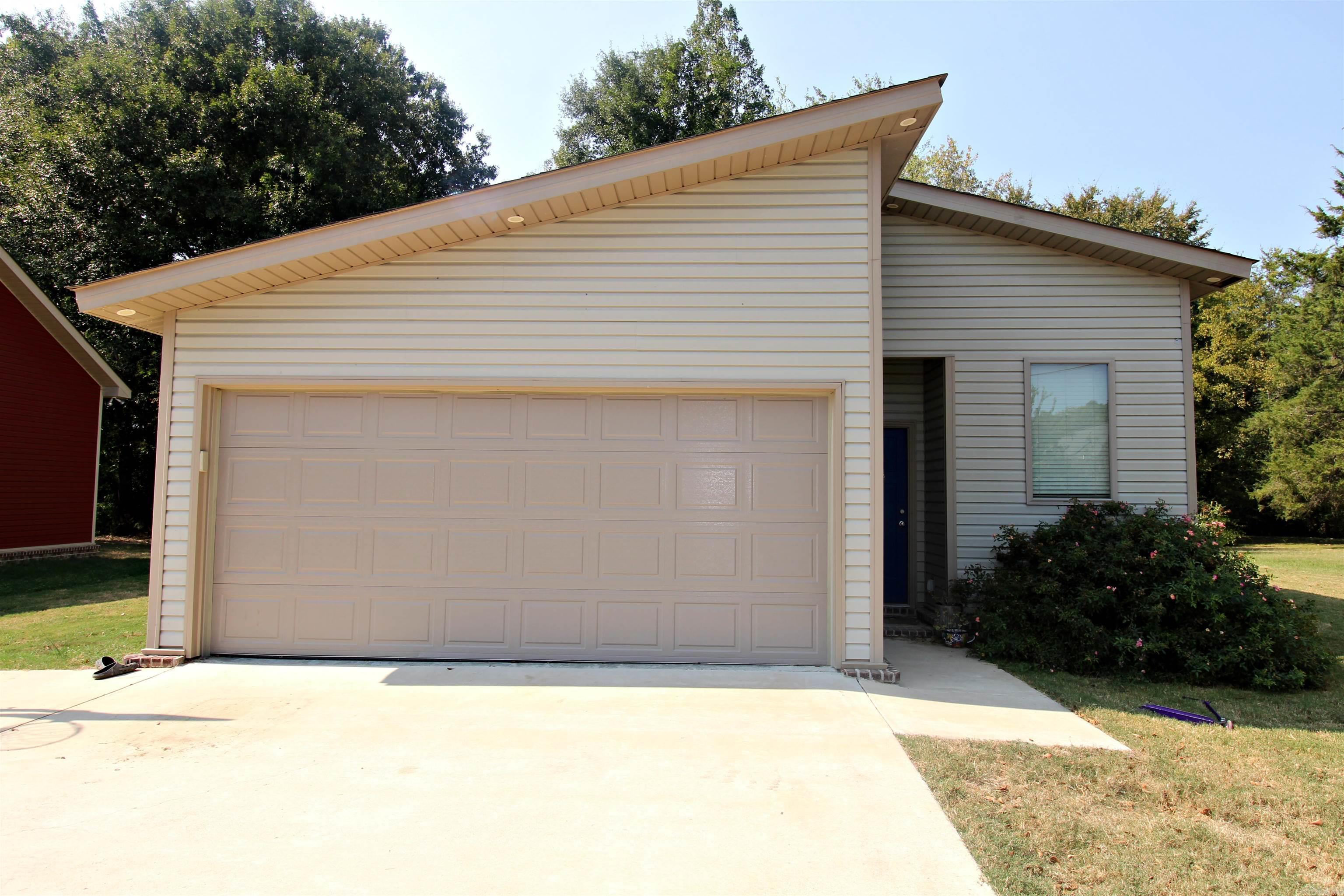 Beautiful Contemporary Style Home with concrete floors, granite counter tops, open concept and nice backyard. 4 bedrooms with one bath upstairs and one down. Come see this lovely home with modern touches, close to all amenities and ready to move into. House was built in 2020. So everything is relatively NEW.