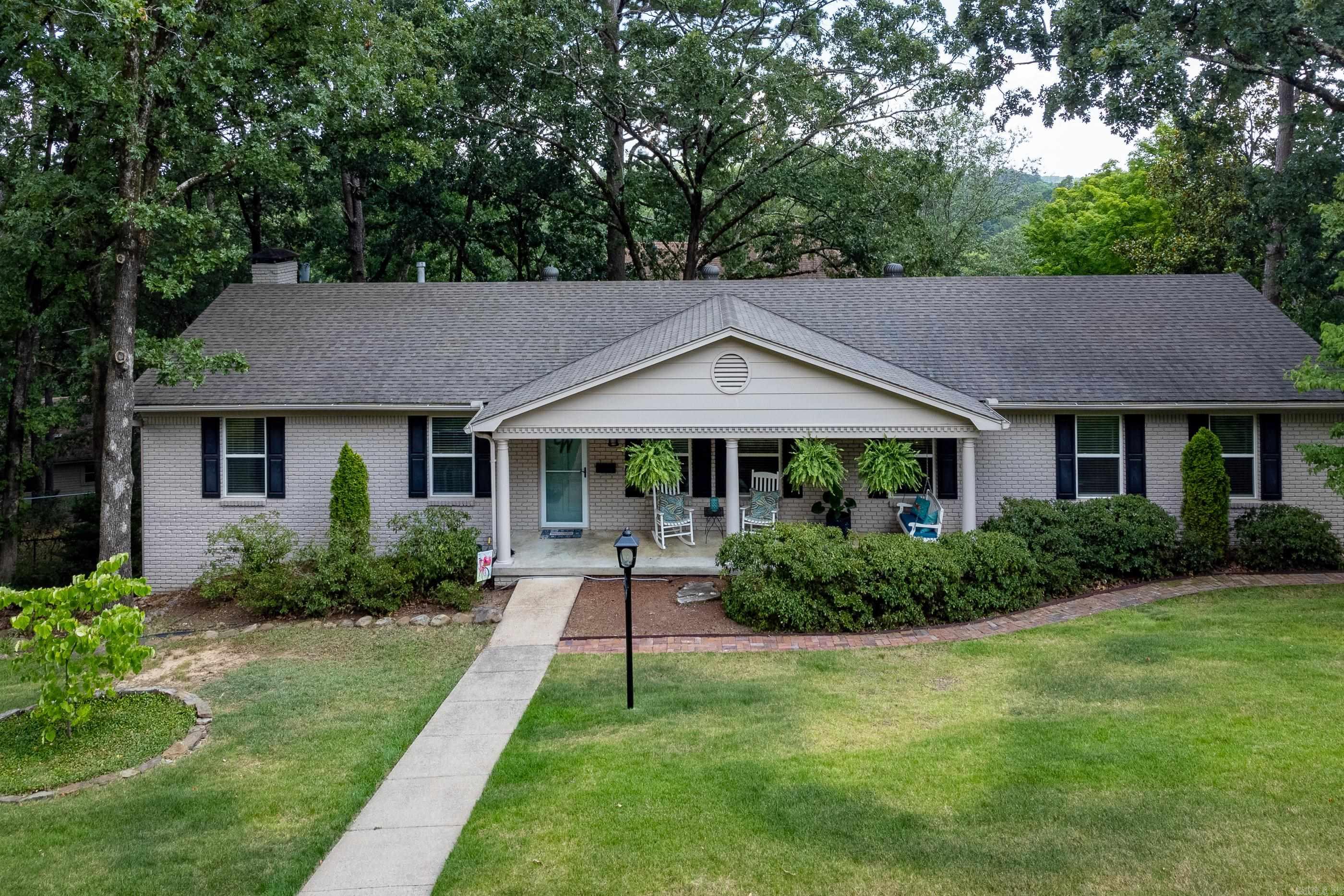 Beautifully remodeled and updated house on lovely landscaped corner lot. Complete transformation of this wonderful home showcases amazing open floor plan, gorgeous kitchen and baths and new flooring. Main level with living area, dining, office/formal living, guest bedroom with en-suite bath and large closet and hall powder bath. Primary bedroom is spacious with fabulous bath and huge shower. Fantastic wall of cabinetry in the kitchen for great storage, pantry, stainless steel appliances and slab granite counters. Laundry room and two car garage with storage room. Downstairs is second living/family game room with wet bar. Two bedrooms, full bath and great storage room also. Delightful back deck, patio and large fenced yard perfect for kids, pets and entertaining. Come see!