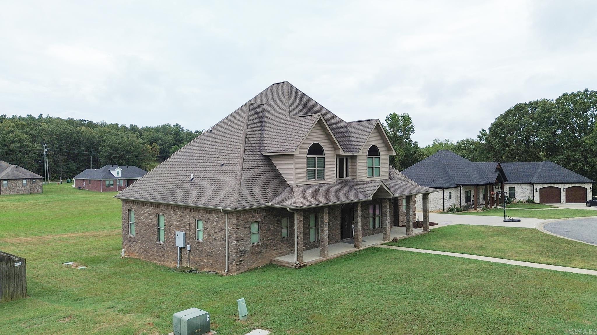 This stunning rural home, set on over half an acre, perfectly blends space, style, and comfort. With 5 bedrooms and 3.5 baths, the home's layout is designed to accommodate everyone in a semi-open concept, creating an ideal flow for daily living and entertaining. Upon entry, you'll be welcomed by soaring ceilings and elegant wood vinyl plank flooring, which leads to expansive dining and living areas—perfect for gatherings and relaxation.  The gourmet kitchen features luxurious granite countertops, a central island, a private pantry, and plenty of cabinet space. Natural light pours through large windows, making the home feel bright and airy.  The spacious primary suite offers a tranquil retreat with a lavish bathroom featuring a walk-in shower, a jacuzzi tub, and generous closet space. The oversized backyard is perfect for outdoor entertaining, with a large patio area ideal for grilling, enjoying meals, or spending time with family and friends.  Additional features include a side-facing two-car garage and ample extra parking space. With so many wonderful details, this home offers a rare opportunity to own a truly exceptional property!