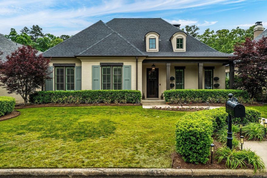 Set within the prestigious gated enclave of Chenal’s Hallen Court, this exceptional single-level residence embodies refined craftsmanship and custom finishes throughout. Ideally located near Chenal Country Club, the home offers a seamless blend of convenience and exclusivity.Rich hardwood flooring and elegant plantation shutters frame a thoughtfully designed interior, complemented by a private office with French doors, thoughtfully updated with custom floor-to-ceiling bookshelves to create a refined library. The open-concept living area extends effortlessly outdoors through three sets of doors to a covered patio complete with a fireplace and fully equipped outdoor kitchen.The gourmet kitchen is a true focal point, featuring double ovens, a six-burner cooktop, and an expansive island with bar seating. The oversized primary suite offers a serene retreat with a soaking tub, dual-head walk-in shower and an oversized walk-in closet. Each additional bedroom is appointed with its own en-suite bath, ensuring privacy for family and guests.A rear-entry three-car garage with a golf cart charging station and HOA services providing complete lawn care allow for a low maintenance lifestyle.