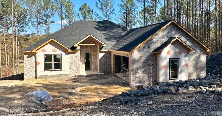 NEW construction on the 14th fairway of GRANADA golf course by McMillan Homes is nearing its final stages. Once complete, this traditional 3/2 is sure to be a showstopper as it features an all brick exterior that's complimented with stone accents and nicely finished with landscaping. The interior is set to offer luxury vinyl flooring throughout with tile dedicated to the bathrooms, quartz countertops, and plenty of storage. It comes with a 1 year builder warranty and has an estimated completion date of late 2023-early 2024. Call today to schedule a showing.