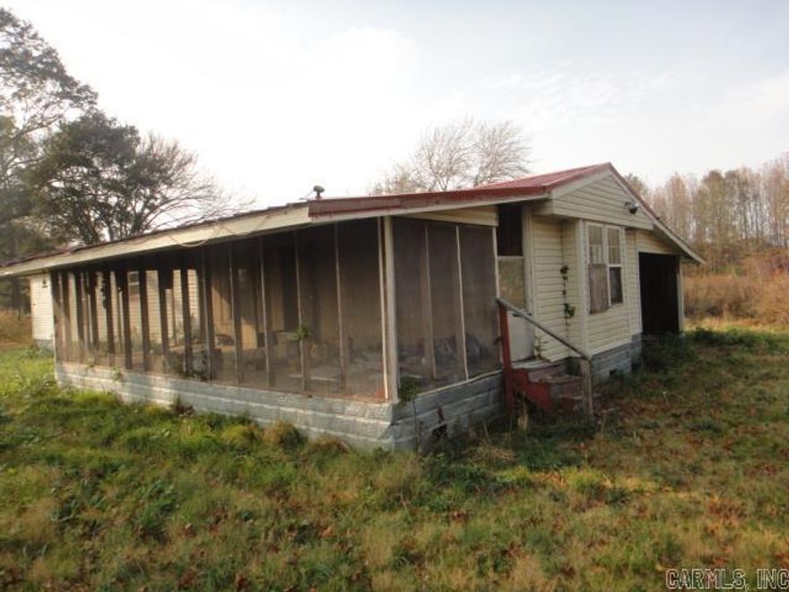 Nice rural setting. 3 acres with mobile home. Property also has a storm cellar. See Agent Remarks for submitting an offer.