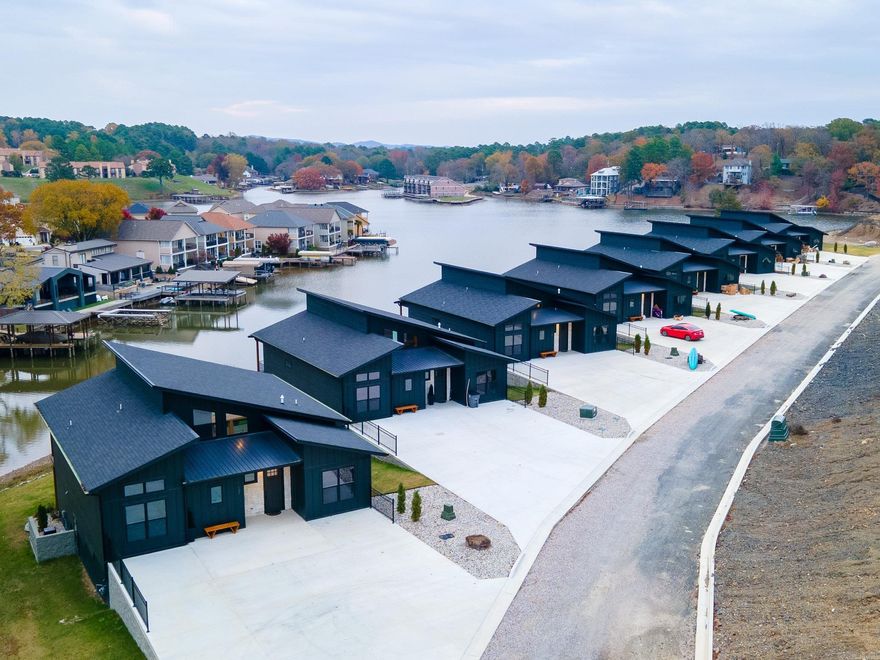 Discover an unparalleled investment opportunity with 8 brand-new luxury lakefront homes, ideally located in the vibrant and historic town of Hot Springs, Arkansas. These breathtaking properties combine waterfront tranquility with proximity to some of the region's most iconic attractions, offering the perfect blend of relaxation and excitement. Each home features 7 spacious bedrooms, 4 luxurious bathrooms, sleeping 16 people per home, two expansive living areas, a private home theater, and an elevated second-story deck with sweeping lake views. Enjoy year-round comfort with a private heated pool for each residence and seamless lake access via dedicated boat slips.    Situated just minutes from Hot Springs’ most popular attractions, these homes offer unmatched convenience. Guests can experience the thrills of Oaklawn Racing Casino Resort, the charm and history of Bathhouse Row, the natural beauty of Garvan Woodland Gardens, and the scenic splendor of Hot Springs National Park.    With a projected annual income of $1.2 million, this development is a rare opportunity for investors looking to secure a lucrative vacation rental portfolio. *Income & expenses are estimates. *
