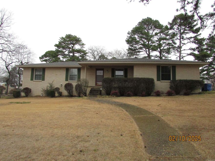 This well maintained brick  home will check off a lot of your boxes! Nice open floor plan. There's a den with a fireplace and a formal living room. Kitchen has lots of cabinets. Primary bedroom has a walk in closet. New shower and flooring in the primary bathroom. Heating unit and roof have both been replaced in the last few years. Over a 1/2 acre corner loti has ample space for your garden. The covered pavilion is perfect for BBQ's. The handicap ramp ion the garage can be removed to make more space for parking. This one won't last long.