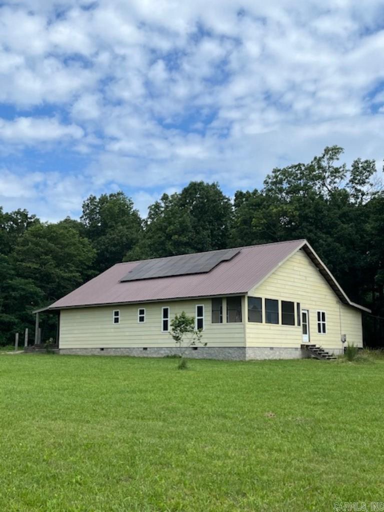 No. 025036 For Sale ā Unfinished Home on 11.33 Acres | 2118 Jimmy Creek Road, Fox, Arkansas Opportunity awaits with this 1802 sq ft unfinished home nestled on 11.33 beautiful acres in the heart of the Ozarks. With 9-foot ceilings and hardy plank siding already in place, this home offers a solid start and a blank canvas for you to finish exactly how you like. Materials to complete portions of the build are included, giving you a head start toward your dream retreat. Enjoy the outdoors with 945 sq ft of open porches, a 211 sq ft screened-in porch, and plenty of space to entertain or relax. The property features city water, solar panels with an assumable loan, and two RV hookupsāideal for hosting guests or future rental possibilities. One RV will convey with the property. A 22 x 24 shop and second open storage building provides storage or workspace for projects and tools. With county road frontage and a peaceful, private setting, this location is the perfect blend of convenience and seclusion. Finish this home to suit your visionāwhether it's a full-time residence, weekend getaway, or investment. Priced to reflect the unfinished status, this is your chance to own a slice of Arkansas