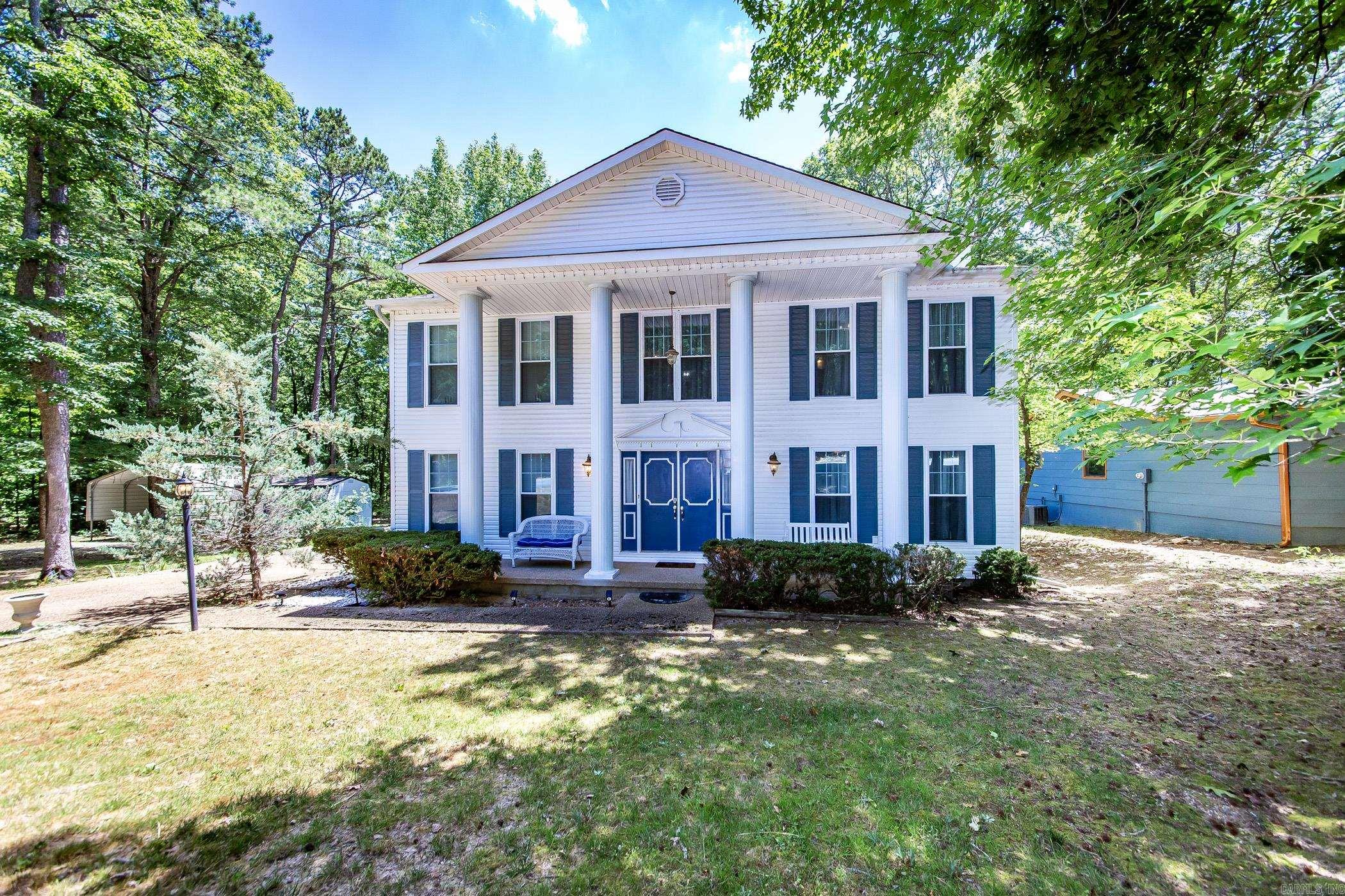 Step into a world of elegance & comfort with this remarkable Colonial-style home, located directly on the picturesque fairway of Indian Hills Golf Course, overlooking Fairway #3. Ideal for golf lovers & outdoor enthusiasts alike, this residence offers a unique lifestyle in the heart of Fairfield Bay. For those who enjoy lake activities, a convenient boat launch is just 2.8 miles away, providing effortless access to Greers Ferry Lake for all your boating & water sports adventures. Fairfield Bay is an outdoor resort destination, offering a wealth of activities such as ATV/UTV trails, hiking/biking trails. The community features two exceptional golf courses, pickleball, and tennis courts, and a full-service marina. Inside, the home boasts beautiful hand-scraped hardwood flooring that brings warmth & sophistication. The large master spa bathroom provides a luxurious retreat, & the private sunroom off the master bedroom is perfect for peaceful mornings or relaxing evenings. There is also a sunroom on the main level of the home. The kitchen is equipped with everything needed to entertain family & friends including a large butler’s pantry. There is an outdoor storage & carport for toys.
